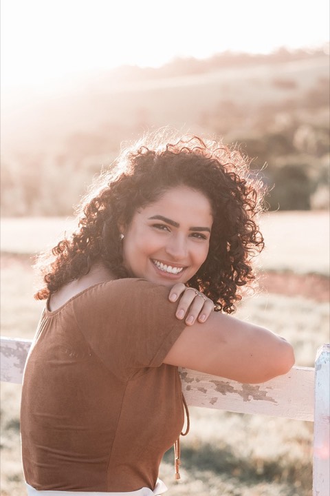 Portrait of a smiling woman with curly hair