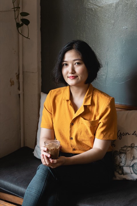 Portrait of a woman in a yellow shirt